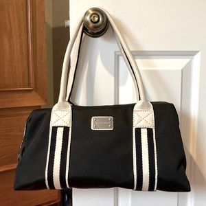 Black and white Michael Kors purse.